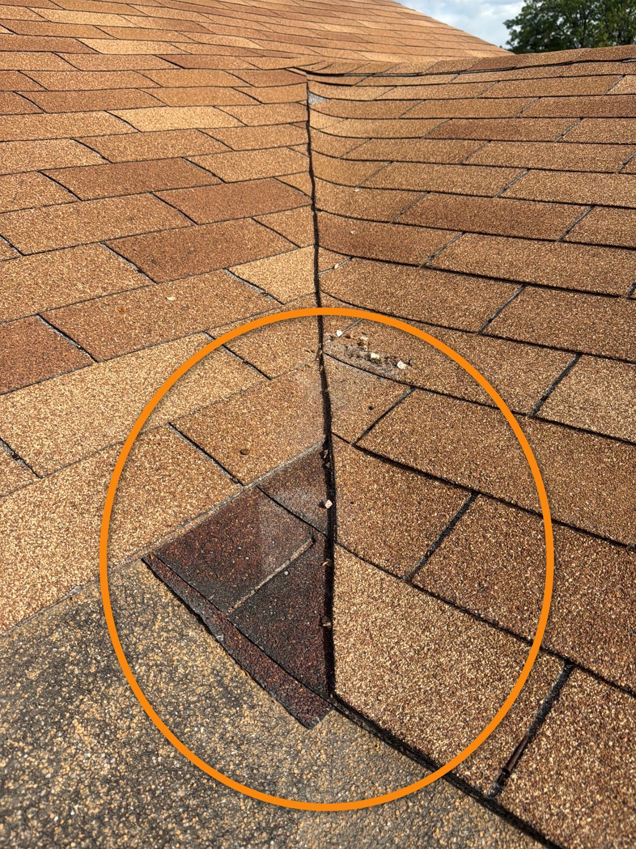 Close-up of asphalt shingles at a roof valley during a home inspection